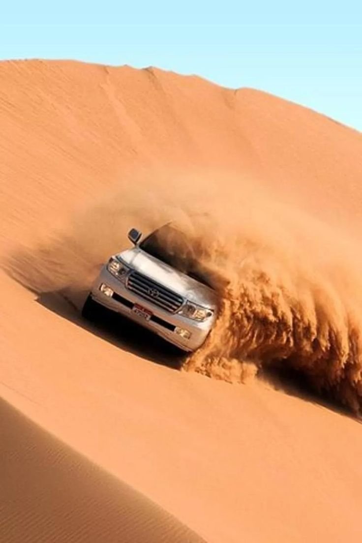 Abu Dhabi desert safari dune bashing in a Land Cruiser in the Al Khatim desert