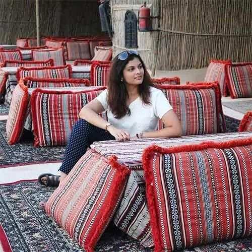 Guests relaxing in a traditional majlis at an Abu Dhabi desert safari camp